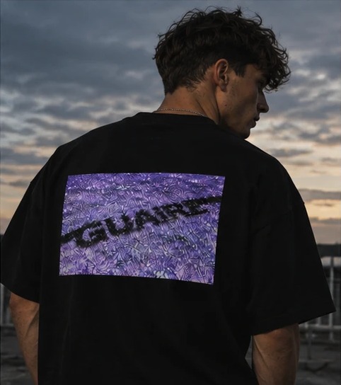 Looking over his shoulder at dusk, the purple back print in full view.